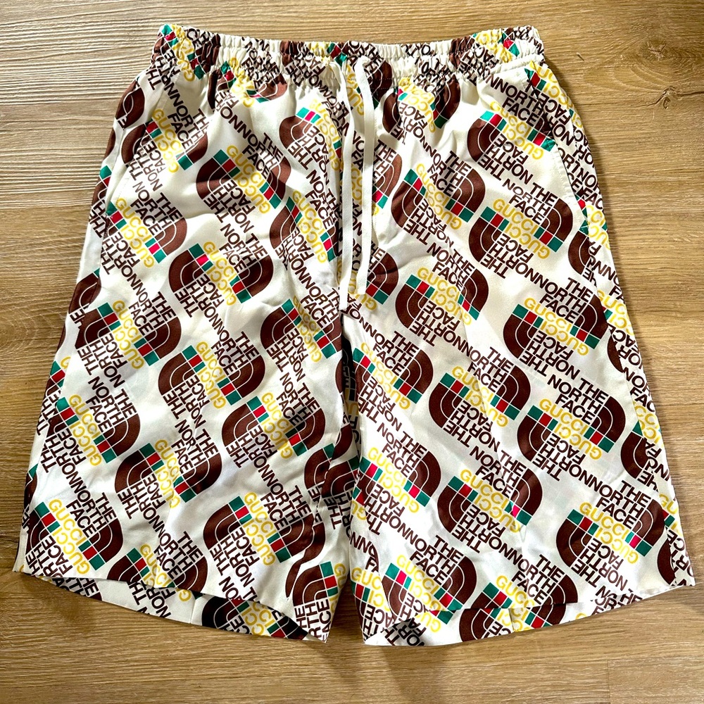 Gucci vs north face swim trunk
